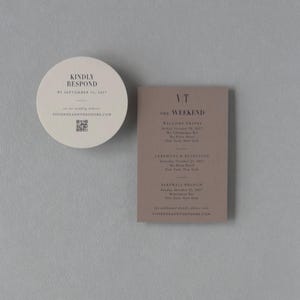 Ivory round RSVP card, taupe details card and black wedding invitation displayed with a dramatic city skyline envelope liner for a modern urban wedding.