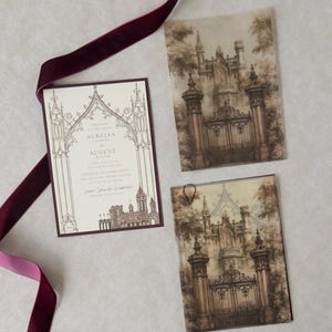 Gothic European castle wedding invitation layered with an ornate architectural vellum overlay, illustrated stone gates, Wedding Cream invitation with Bitter Chocolate backing, and rich burgundy velvet ribbon on a neutral textured background.