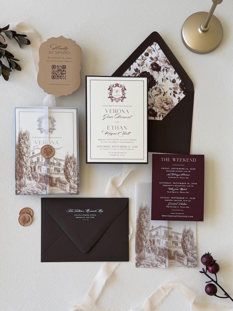 European villa wedding invitation with printed vellum wrap and patterned burgundy envelope liner