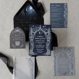 Ophelia moonlit Gothic wedding invitation collection with Imperial Navy invitation, Marina details card, Dark Grey shaped RSVP, printed vellum jacket, and Ebony envelope with nighttime castle scene liner.