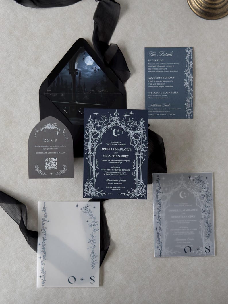 Ophelia moonlit Gothic wedding invitation collection with Imperial Navy invitation, Marina details card, Dark Grey shaped RSVP, printed vellum jacket, and Ebony envelope with nighttime castle scene liner.