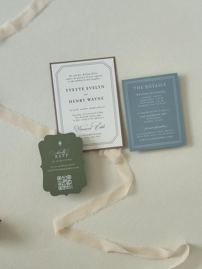Ivory country wedding invitation with dusty blue details card and dark green scalloped RSVP card, styled with soft cream ribbon for a romantic estate or countryside wedding.
