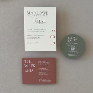 Ivory Marlowe wedding invitation paired with clay details cards, olive green circular RSVP card and coordinating envelope for a modern earthy wedding palette.