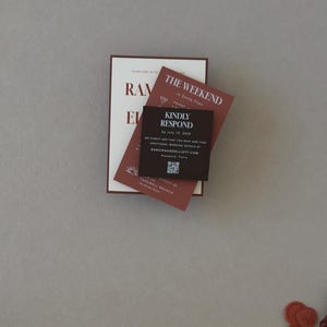 Terracotta and dark brown wedding stationery cards featuring modern typography and warm rust tones from the Ramona wedding invitation suite.