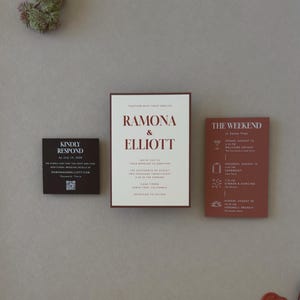Warm ivory layered wedding invitation paired with terracotta details card and dark chocolate RSVP card for a moody modern wedding invitation suite.
