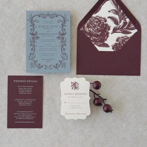 Elegant blue and burgundy wedding stationery suite with botanical details for a romantic garden or estate wedding