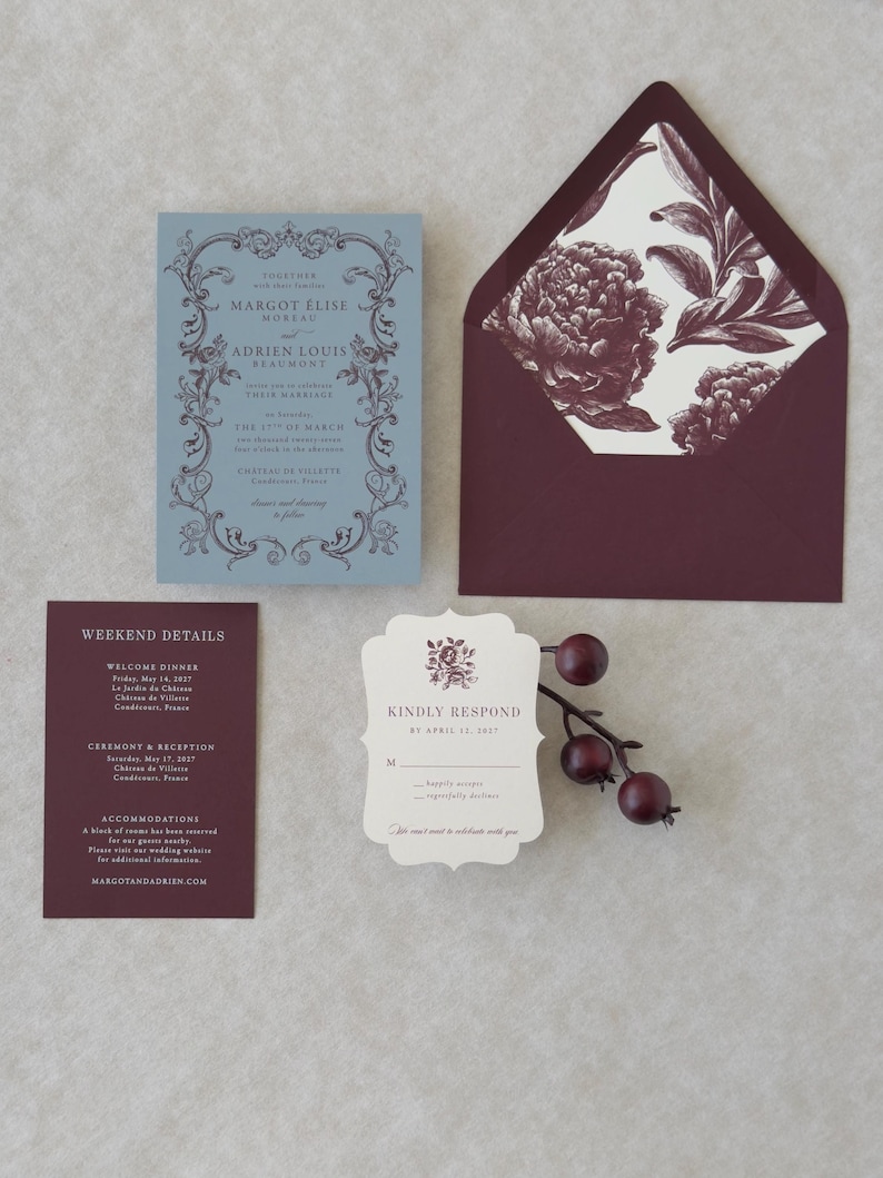 Elegant blue and burgundy wedding stationery suite with botanical details for a romantic garden or estate wedding