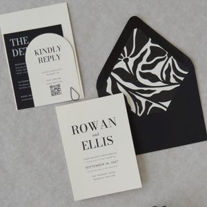 Black and ivory Ellis wedding invitation suite with modern typography and coordinating envelope liner