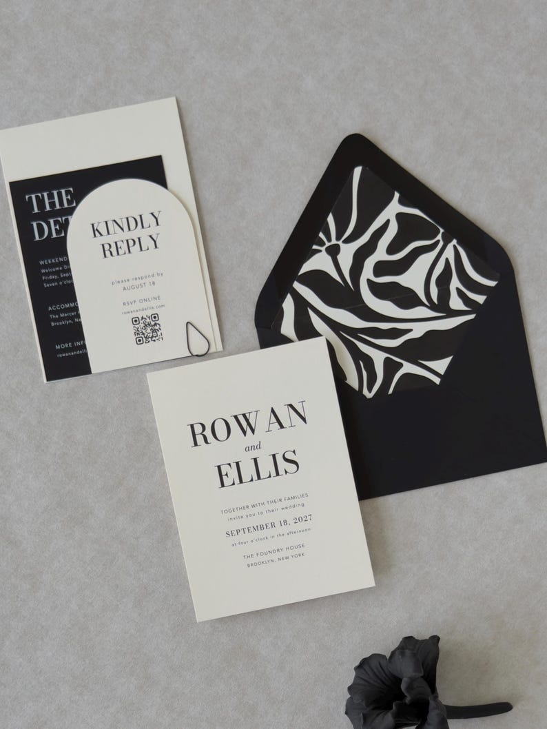 Black and ivory Ellis wedding invitation suite with modern typography and coordinating envelope liner