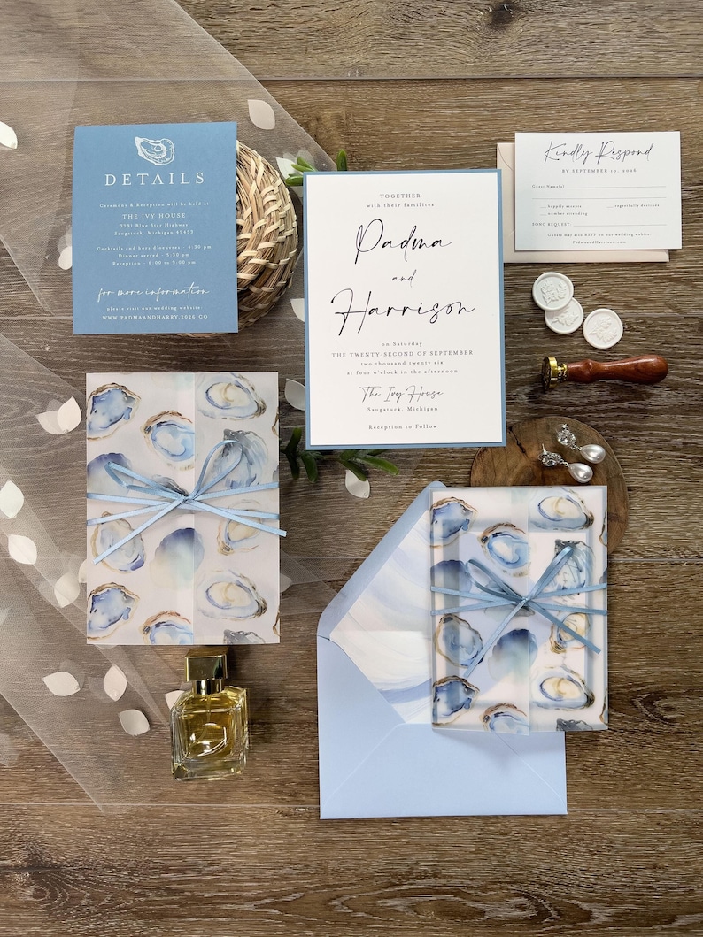 Coastal Oyster Wedding Invitation Suite with vellum jacket, envelope liner, and blue ribbon