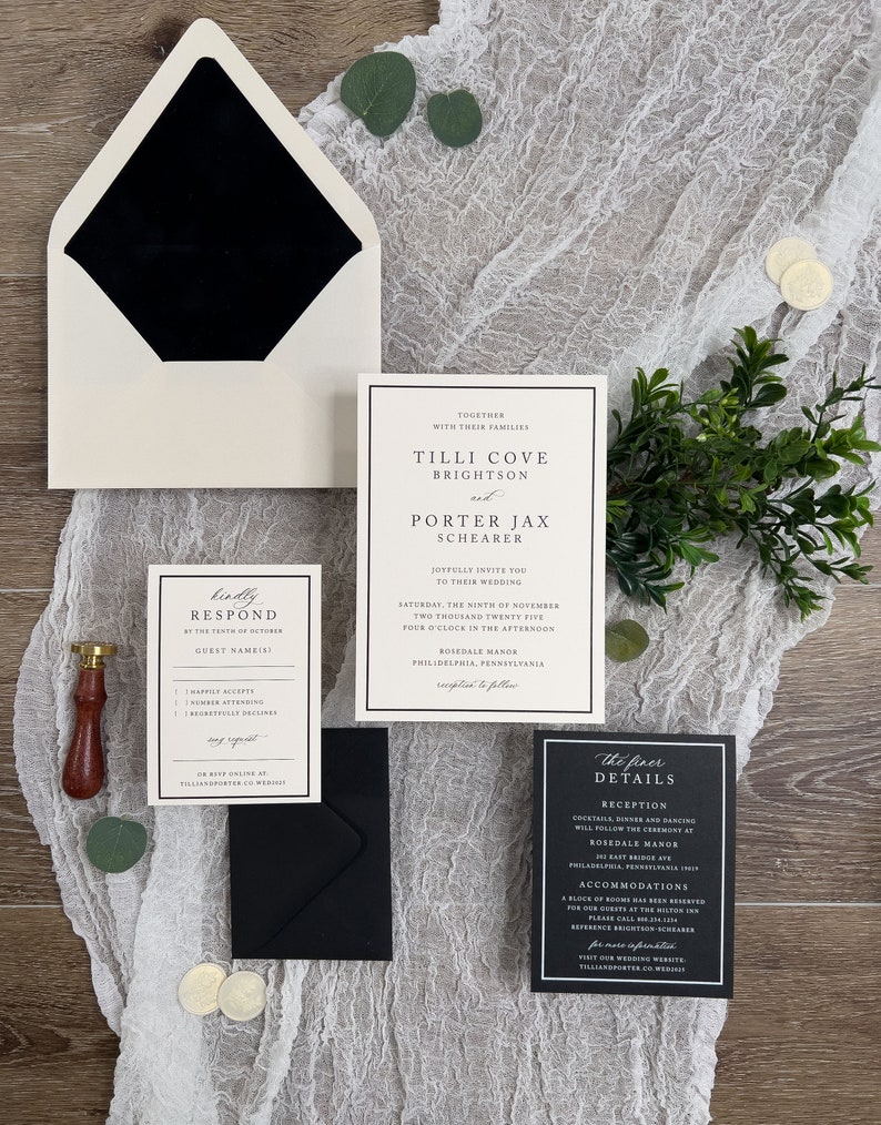 May include: Black and white wedding invitation suite with a white envelope, a black inner envelope, and three cards. The main card features the couple's names, wedding date, and location. The second card is a response card with a black border and white text. The third card is a details card with a black border and white text.