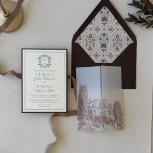 Dusty blue European wedding invitation suite with patterned envelope liner, vellum wrap