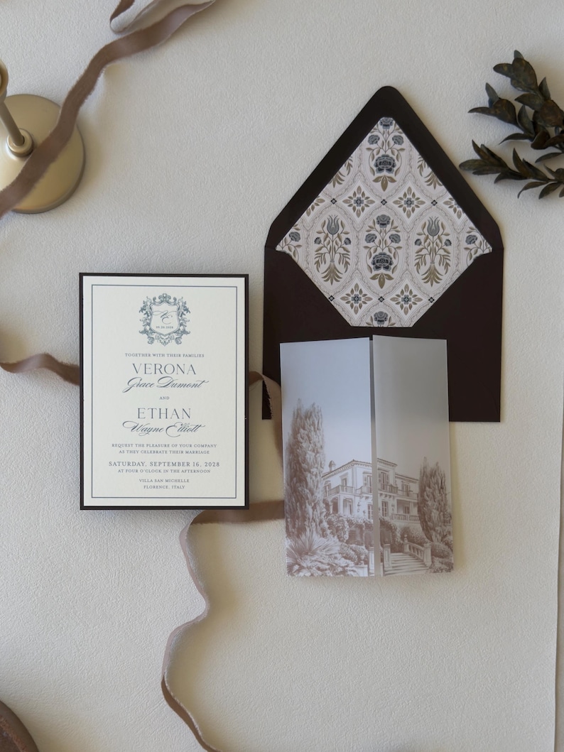 Dusty blue European wedding invitation suite with patterned envelope liner, vellum wrap