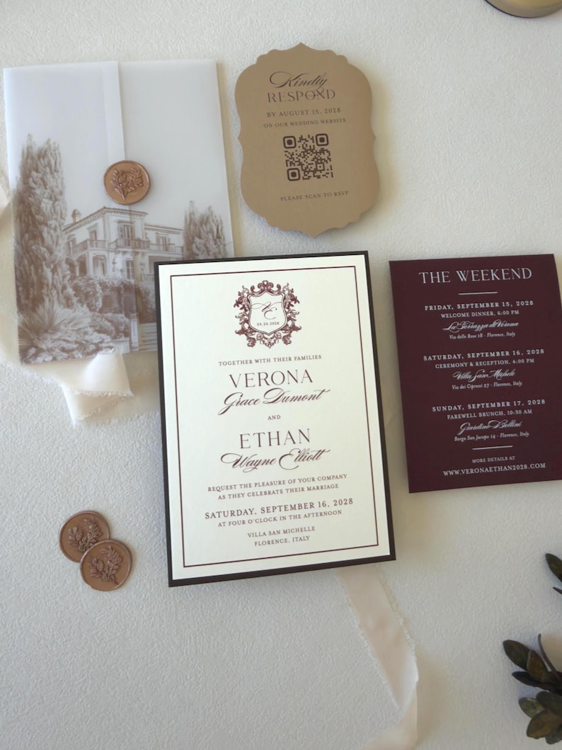 Burgundy wedding invitation suite with patterned envelope liner, vellum wrap and coordinating details card