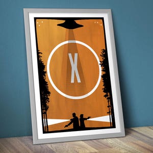 May include: A minimalist poster with a black silhouette of two figures standing in a forest. A white circle with a black "X" in the center is in the middle of the poster. A black silhouette of a flying saucer is at the top of the poster. The background is orange.
