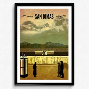 May include: A vintage-style poster with the text "SAN DIMAS" in a stylized font. The poster features a stylized illustration of a building with a K-Mart sign, three figures in silhouette, and a mountain range in the background.