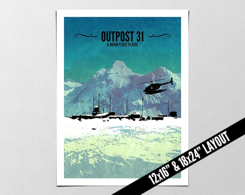 May include: Poster print with a mountain scene, a helicopter, and silhouettes of buildings. The text reads "OUTPOST 31 A WARM PLACE TO HIDE". The layout size is 30.5x40.6 cm and 45.7x61 cm.