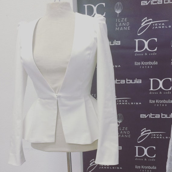 Ivory peplum jacket on sale
