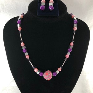 Pink and purple beaded necklace with hematites, glass pearls and a chunky centre bead, magnetic clasp, UK shop