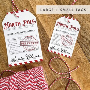 May include: Two printable North Pole gift tags with red and white stripes. The larger tag has the text "North Pole Special Delivery For your child's name!" and a red "Delivered" stamp. The smaller tag has the same text and stamp, but is smaller in size.