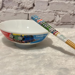 2002, 2003 Bol de riz et baguettes Thomas et Percy
