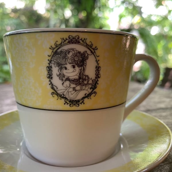 Taza de café Peko vintage de los años 90 con platillo