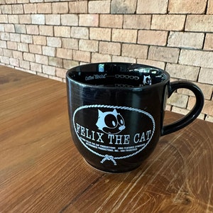 1986 Felix the cat black coffee mug