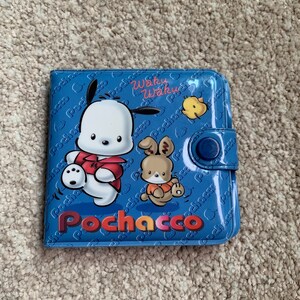 May include: A blue wallet with a cartoon character named Pochacco. The wallet has a snap closure and features the text "Waku Waku" and "Pochacco" in a colorful font.