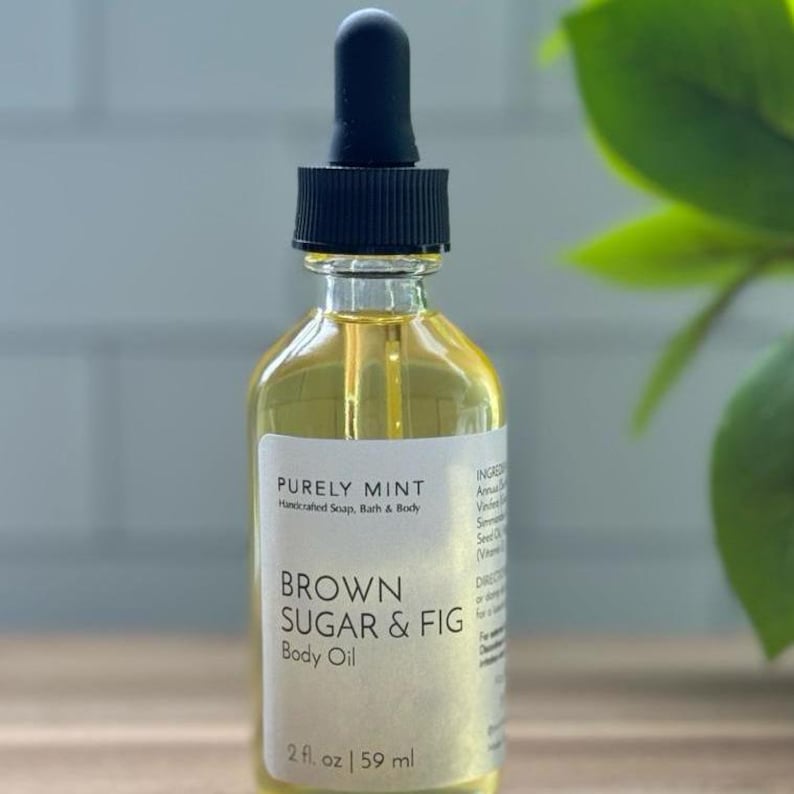 Organic Vegan Body Oil: Nut-Free, Sensitive Skin, Natural Moisturizer in a clear glass bottle with a black lid filled with Brown Sugar & Fig body oil.