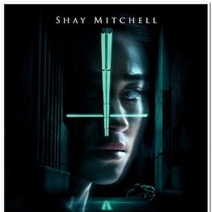 May include: A movie poster for the horror film "The Possession of Hannah Grace", starring Shay Mitchell. The poster features a close-up of Mitchell's face with a glowing green cross over her eyes. The text "The Possession of Hannah Grace" is in large, bold letters below her face. The tagline "Death is only the beginning." is below the title. The release date "November 30" is at the bottom of the poster.