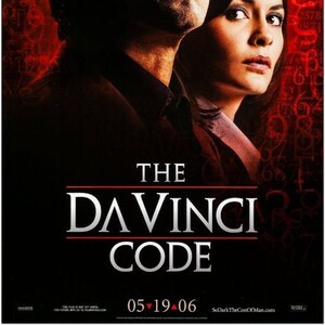 May include: A movie poster for the film "The Da Vinci Code" featuring Tom Hanks and Audrey Tautou. The poster is red with white text and a background of numbers and symbols.
