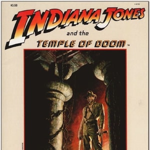 May include: A vintage magazine cover featuring Indiana Jones and the Temple of Doom. The cover art depicts Indiana Jones standing in a dark, jungle-like setting, holding a whip and a sword. The title "Indiana Jones and the Temple of Doom" is printed in bold, red letters.