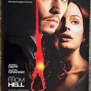 May include: Movie poster for "From Hell" featuring Johnny Depp and Heather Graham. The poster has a dark background with a red streak down the middle. The movie title is prominently displayed, along with the release month.