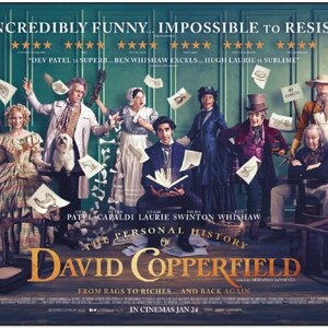 May include: A movie poster for the film "David Copperfield" featuring a cast of actors in period clothing. The poster has the title of the film in large gold letters and the tagline "From rags to riches... and back again".