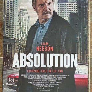 May include: Movie poster for the film Absolution starring Liam Neeson. The poster features a close-up of Liam Neeson in a dark jacket, with a city backdrop. The title of the film is in large, bold letters, and the tagline is "Everyone Pays in the End".