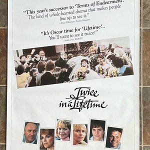 May include: Movie poster for the film "Twice in a Lifetime" starring Gene Hackman, Ann-Margret, Ellen Burstyn, Amy Madigan, Ally Sheedy, and Brian Dennehy. The poster features a wedding scene with the bride and groom walking down the aisle, surrounded by guests throwing confetti. The poster also includes quotes from reviews of the film.