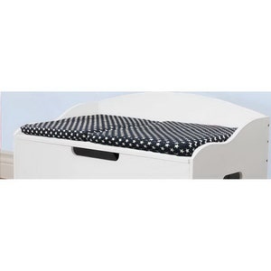 May include: White wooden storage bench with a navy blue and white star patterned cushion on top. The bench has a drawer with a black handle.