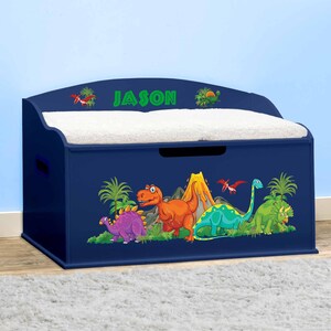 May include: A blue wooden toy chest with a padded lid and a dinosaur themed design. The chest has a handle on the side and the name "JASON" is printed on the front.
