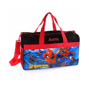 May include: Black and red duffel bag with a Spiderman graphic and the name "Austin" embroidered on the front.