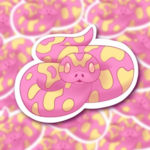 May include: A pink and yellow snake sticker with a curled up pose. The snake has a cute cartoon face with large eyes and a small mouth.