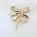 Personalised Gold Bow Pin Cross Brooch with Enamel Initial Luxury Baptism Gift for Baby Girl - Christening Keepsake Charm product logo