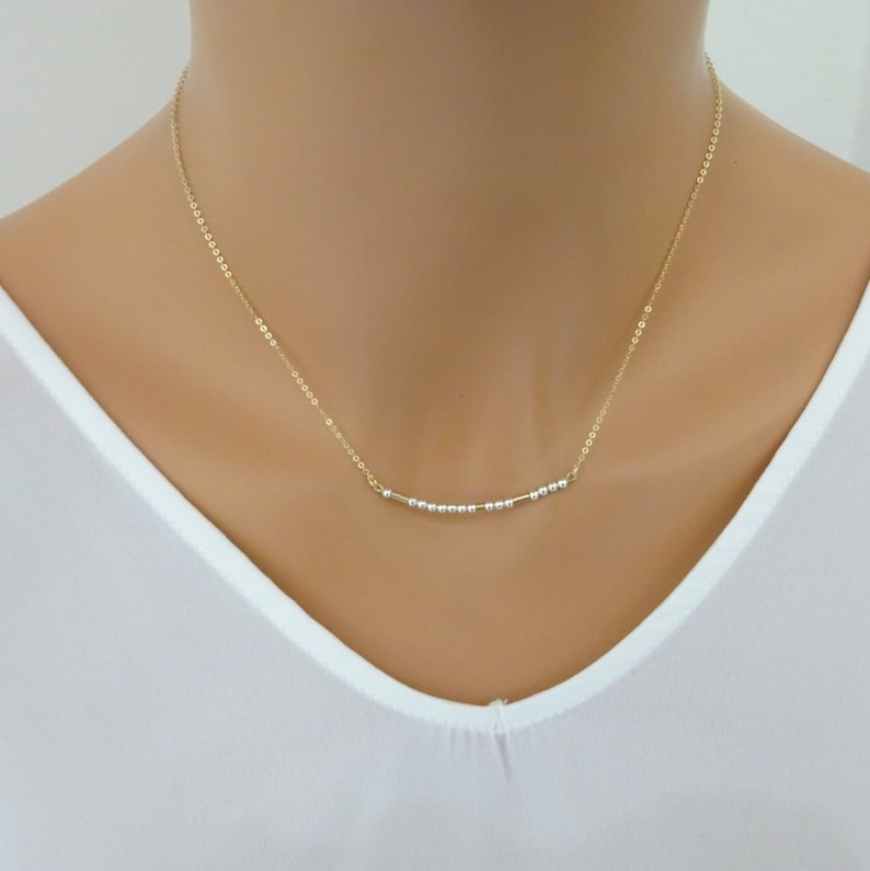 Gold fill Morse code necklace. Dots in Sterling Silver and 14 K Gold fill dashes.