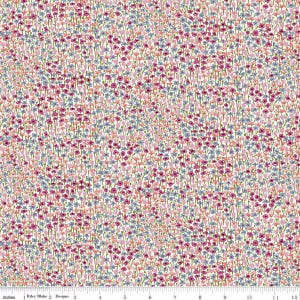Puede incluir: Una tela con un denso estampado floral. El diseño presenta pequeñas flores en tonos rosa, morado y azul, sobre un fondo color crema. Las flores están dispuestas muy juntas, creando una apariencia texturizada. La tela se mide en centímetros.