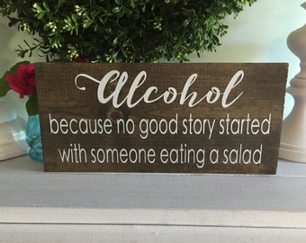 Alcohol because no great story started with someone eating a salad, alcohol sign, wood sign, wooden sign, custom sign, home decor,