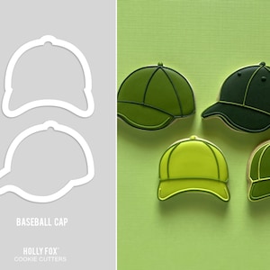 May include: Baseball cap cookie cutters and decorated cookies in shades of green. The cookie cutters are white outlines, and the cookies are various shades of green with dark green details. The text "BASEBALL CAP" and "HOLLY FOX COOKIE CUTTERS" are also visible.