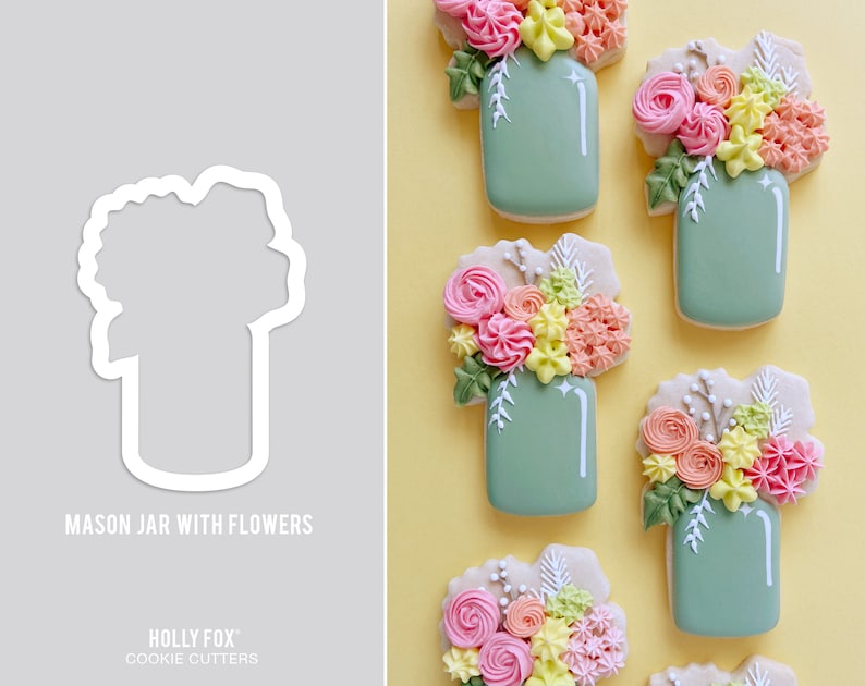 May include: A set of six cookie cutters shaped like mason jars with flowers. The cutters are made of white plastic and are designed to cut out cookies in the shape of mason jars with flowers.
