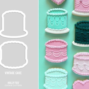 May include: Vintage cake cookie cutters, two different sizes, one with a rounded top and one with a square top.  The cutters are shown on a gray background.  The text "Vintage Cake" and "HOLLY FOX Cookie Cutters" is also shown on the background.