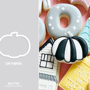 May include: A set of Halloween cookie cutters, including a low pumpkin, a striped pumpkin, a house, a donut, a spiderweb, and a trick or treat bag. The cutters are made of metal and are designed to cut out cookies in the shape of the designs.