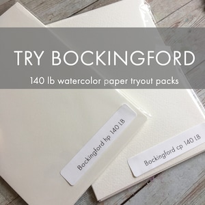 May include: Two packs of Bockingford 140 lb watercolor paper tryout packs. One pack is labeled "Bockingford hp 140 LB" and the other is labeled "Bockingford cp 140 LB". The text "TRY BOCKINGFORD" is at the top of the image.