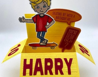 May include: A yellow pop-up card with a cartoon boy on a skateboard. The card says "Skating by with a birthday hi!" and "You're how old?" The card is addressed to "Harry".